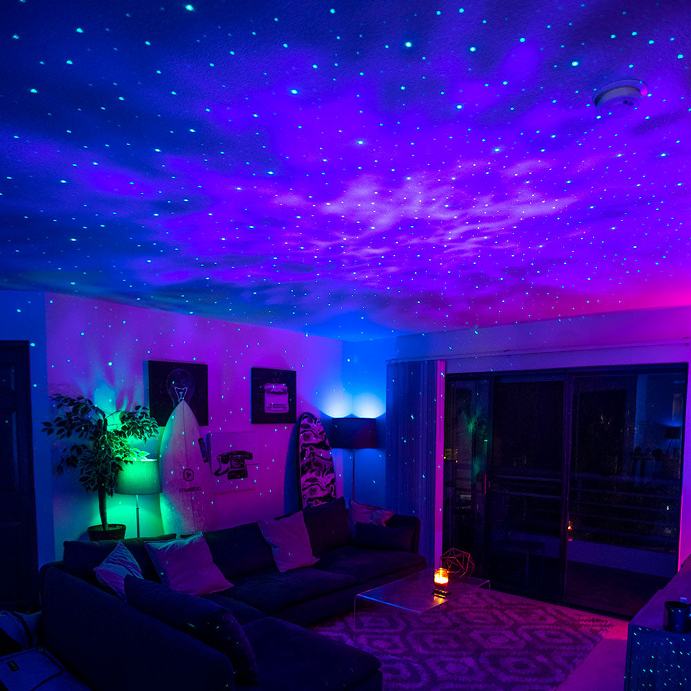 IMAGE 1 · HERO: dark bedroom, galaxy across the whole ceiling, someone in bed looking up. Landscape 16:9.